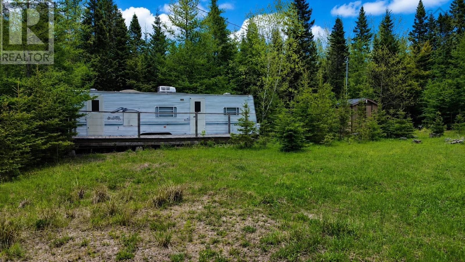 Serviced lot with well and trailer at MacMillan Lake, photo 1